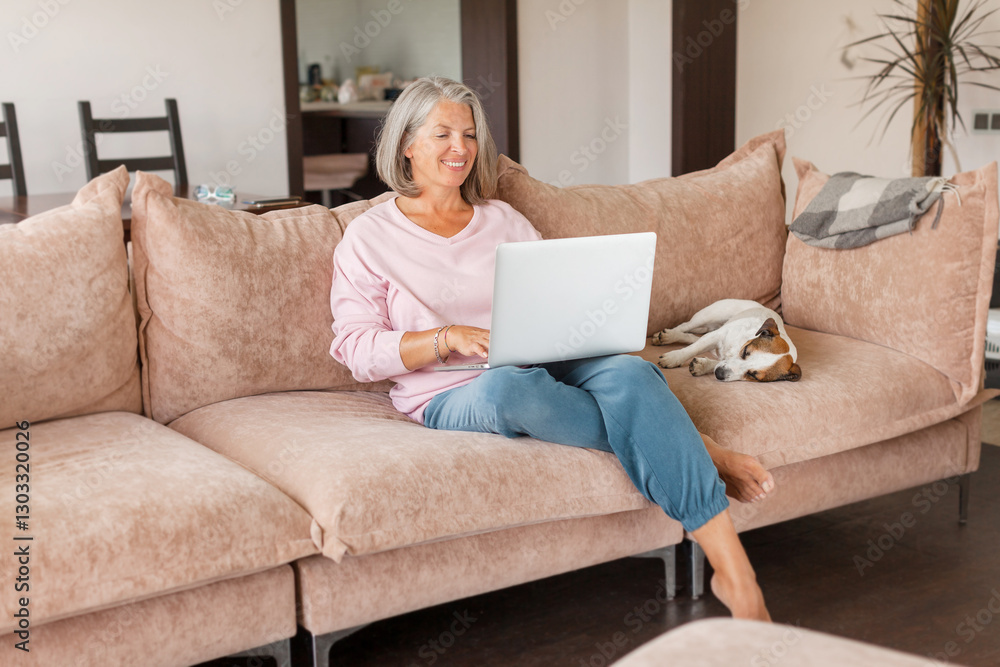 mature woman using wireless laptop apps browsing internet sit on sofa mature woman using wireless laptop apps browsing internet sit on sofa