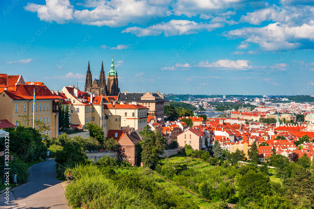 View of Prague featuring historic castle and vibrant rooftops on a sunny day in summer. Aerial view of Prague, Charles Bridge over Vltava river in Prague, Czechia. Old Town of Prague, Czech Republic. View of Prague featuring historic castle and vibrant rooftops on a sunny day in summer. Aerial view of Prague, Charles Bridge over Vltava river in Prague, Czechia. Old Town of Prague, Czech Republic.