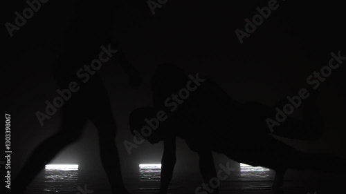 Wallpaper Mural Modern ballet dancers performing together on dark stage. Silhouettes of three performers with smoke in the air. Torontodigital.ca