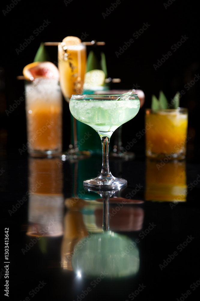 Various alcoholic cocktails on a black background. Various alcoholic cocktails on a black background.