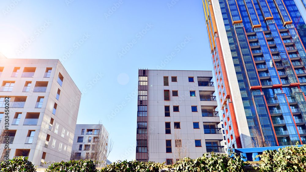 Fototapeta premium Modern and new apartment building. Multistoried modern, new and stylish living block of flats.