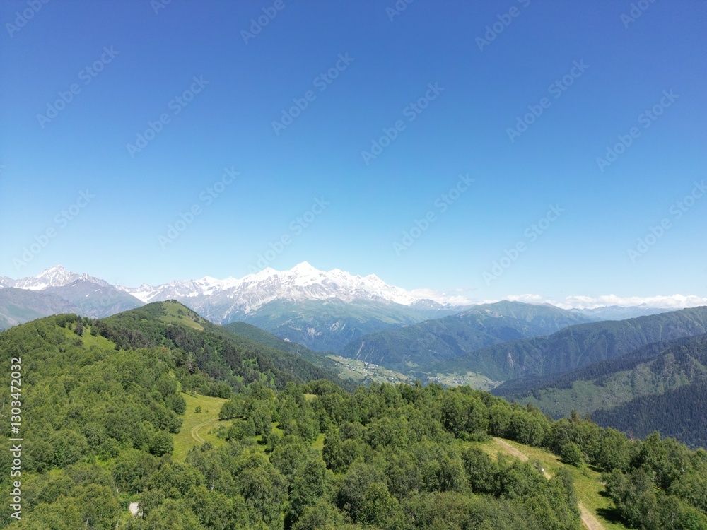 Large mountain range in tranquil landscape no text present Large mountain range in tranquil landscape no text present