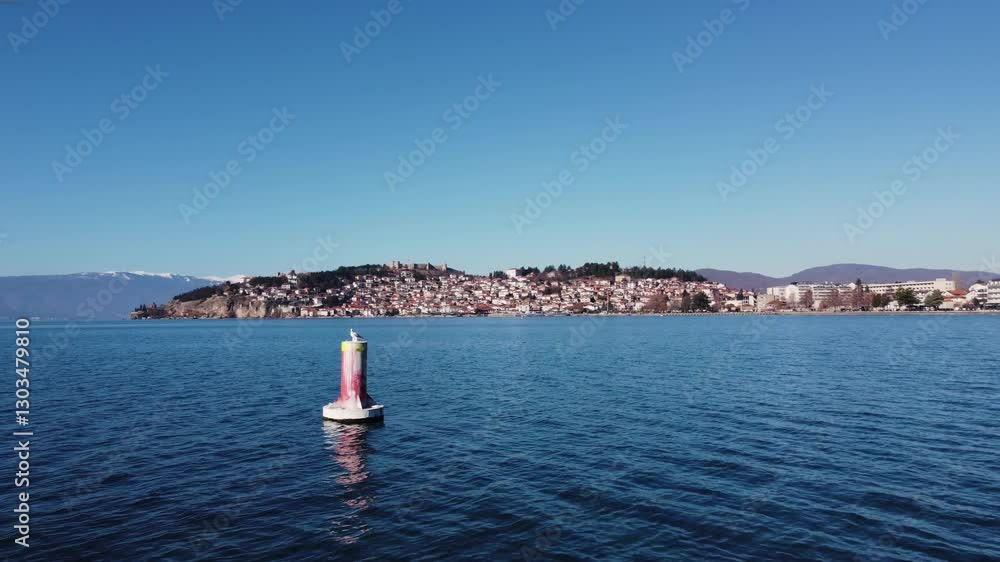 Seagull on Buoy in Lake Ohrid with Ohrid City View Seagull on Buoy in Lake Ohrid with Ohrid City View