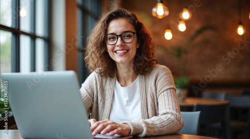  Woman Working on Laptop, Freelance woman, Woman working at office. photo