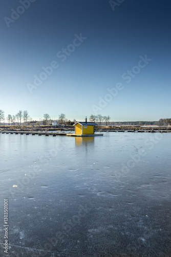 Winter landscape of the frozen Sjotorp Lake, Gota Canal,  Sweden photo