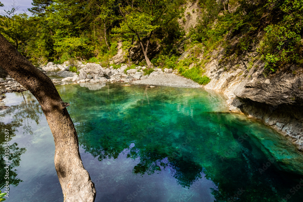 Crystal clear waters of natural springs and lake in the woods of the Mount Olympus, Greece