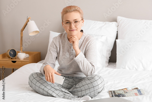 Young woman in pajamas rela...
