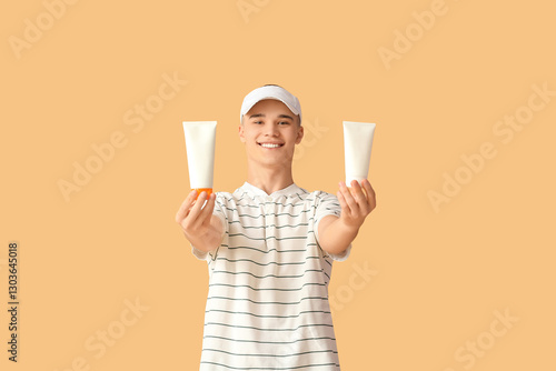 Happy young man with bottle...