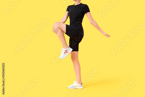 Young woman in cycling jump...