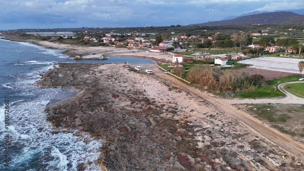 Aerial view of rocky coastline and deep blue sea on a cloudy day, Greece Aerial view of rocky coastline and deep blue sea on a cloudy day, Greece
