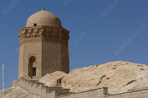 Wallpaper Mural The Grand Tower of Abarkouh, an ancient architectural masterpiece standing tall against the clear blue sky, showcasing intricate Persian craftsmanship and historical significance. Torontodigital.ca