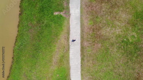 Aerial top down view of people jogging on a trail