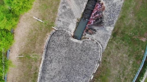 Aerial top down rotating shot of a lake showing architectural pattern