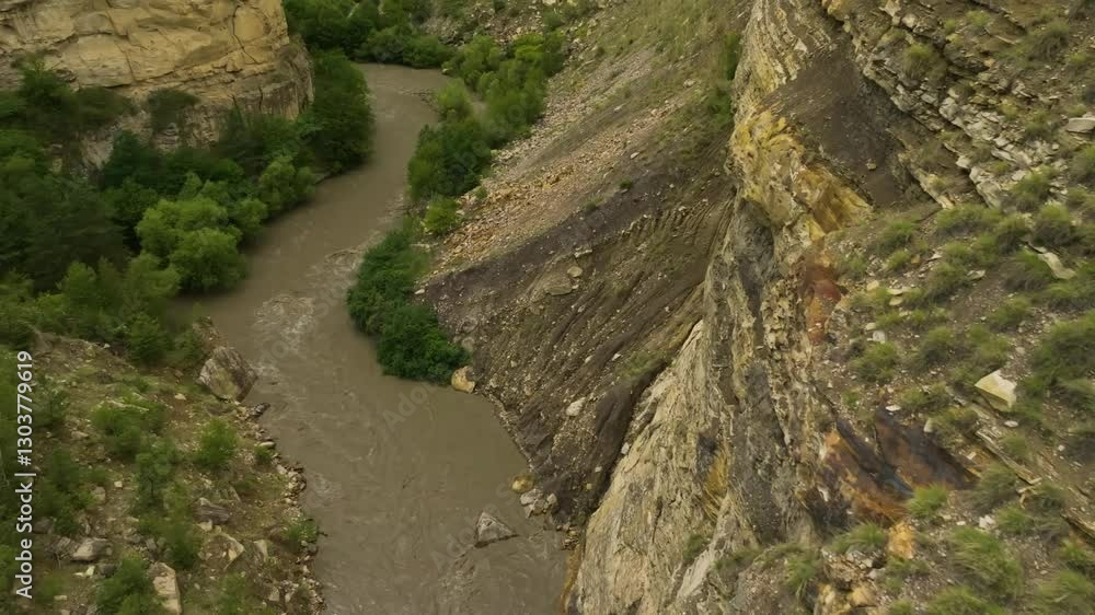 Aerial view of Kara-Koisu River, Dagestan, surrounded by greenery and dense forests, highlighting the natural beauty of the region. Aerial view of Kara-Koisu River, Dagestan, surrounded by greenery and dense forests, highlighting the natural beauty of the region.