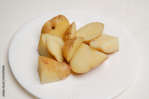 Homemade boiled potatoes on top of a plate for healthy diet and vegetarian menu.