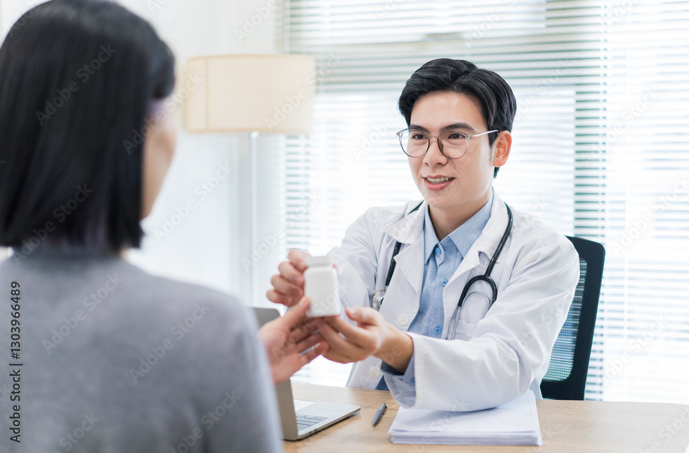Doctor consulting with a patient and providing medication in a modern healthcare setting Doctor consulting with a patient and providing medication in a modern healthcare setting