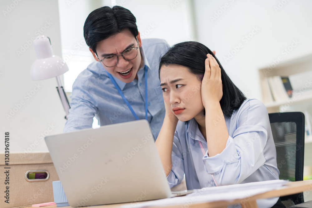 Frustration at work as a man yells at a woman during a stressful office situation Frustration at work as a man yells at a woman during a stressful office situation