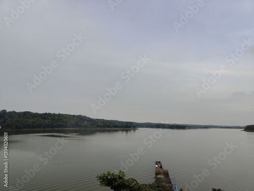 The beauty of Cacaban Reservoir, a reservoir and natural and boat tourism destination in Tegal Regency, Central Java. This reservoir is located in Penujah Village, Kedung Banteng District. photo