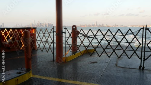 New York City skyline from ferry boat to Staten Island. Manhattan downtown. World Trade Center skyscraper from ferryboat. River waterfront sunset panorama, riverfront buildings architecture, FiDi, USA