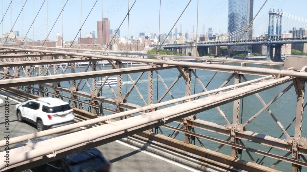 Cars on Brooklyn Bridge, New York City Manhattan Bridge and Midtown view. Yellow taxi cab, Road traffic and architecture. Iconic landmark on East River. Travel USA. Cars on Brooklyn Bridge, New York City Manhattan Bridge and Midtown view. Yellow taxi cab, Road traffic and architecture. Iconic landmark on East River. Travel USA.