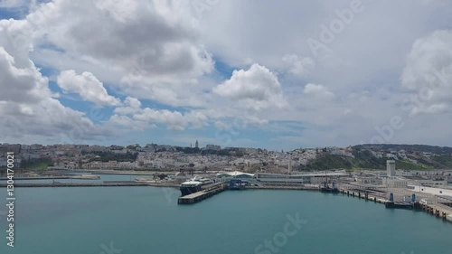 Moroco tangier apr 26 2024 Scenic View of Tangier Port and Cityscape Under Cloudy Skies