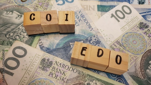Fotografija Polish PLN banknotes and COI and EDO inscription made of letter cubes