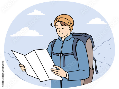 Male traveler check map trekking in mountains