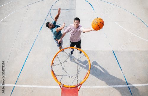 Friends playing basketball outdoors on a sunny day