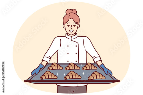 Woman baker holds tray of croissants preparing fresh pastries for sale in own bakery. Girl cook and owner of bakery with smile demonstrates delicious sweet buns for breakfast or lunch