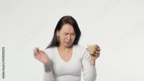 woman tastes tasteless coffee Copy space on a white background