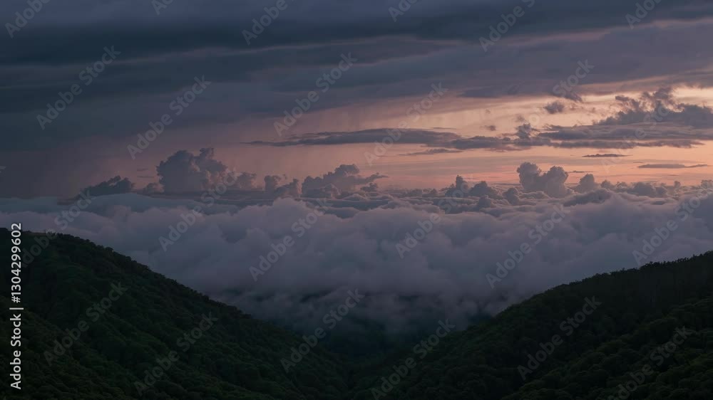 Aerial video of lush green mountains under a dramatic, cloudy sky at dusk, capturing the serene beauty of nature from a high angle. Live desktop wallpaper. Aerial video of lush green mountains under a dramatic, cloudy sky at dusk, capturing the serene beauty of nature from a high angle. Live desktop wallpaper.