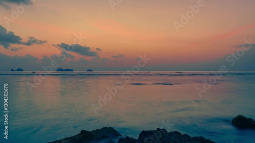 Spectacular colorful sunset over sea and islands in summer evening. 4K time lapse.