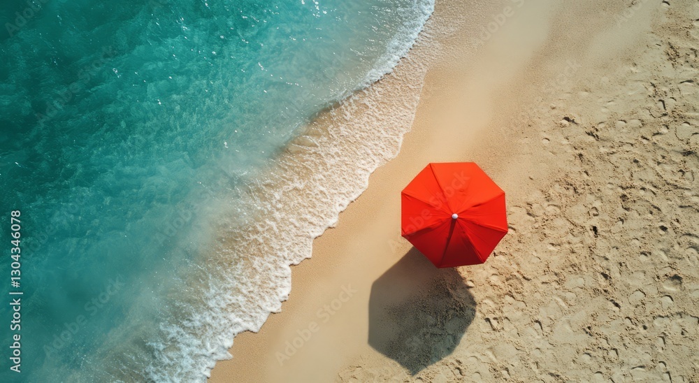 Naklejka premium Ocean Waves and Sandy Shore with a Vibrant Umbrella