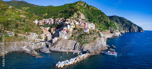 Fototapeta Naklejka Na Ścianę i Meble -  Italy, Cinque terre famous national park of traditional fishing villages. Manarola . Aerial drone view of colorful houses and picturesque bay. popular tourist attraction in Liguria