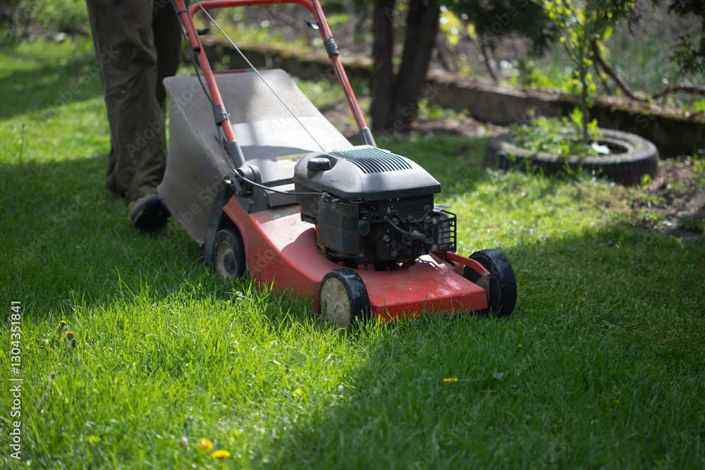 Lawn mover on green grass. Machine for cutting lawns. Lawn mover on green grass. Machine for cutting lawns.