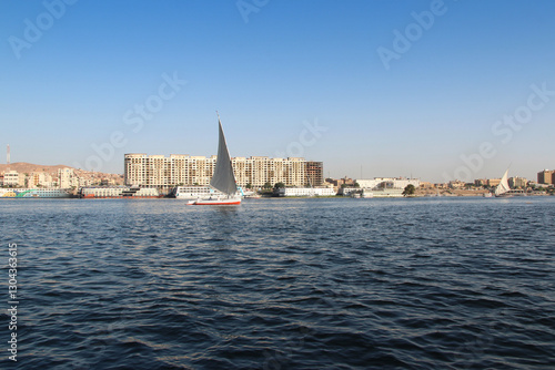 Felucca sailing on Nile River in a sunny afternoon at Aswan, Egypt