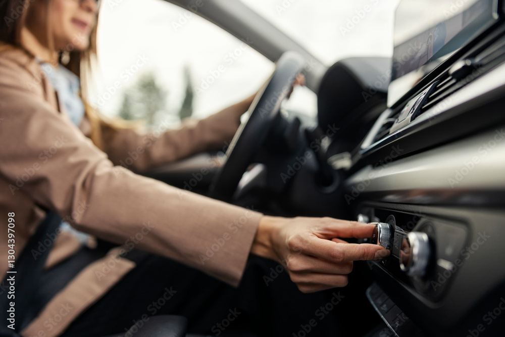 Close up of woman's hand turning air conditioner in car. Close up of woman's hand turning air conditioner in car.