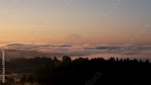 Wallpaper Mural Aerial: foggy fire sky sunrise over Mount Rainier (Tahoma) with clouds and skyscape in Cascade Range, Mount Rainier National Park, west-central Washington state, USA, pull out drone shot Torontodigital.ca