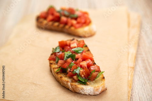 Bruschetta with tomatoes and basil prepared for breakfast