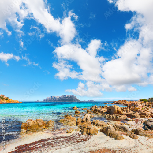Superb azure water with rocks near beach Porto Taverna.