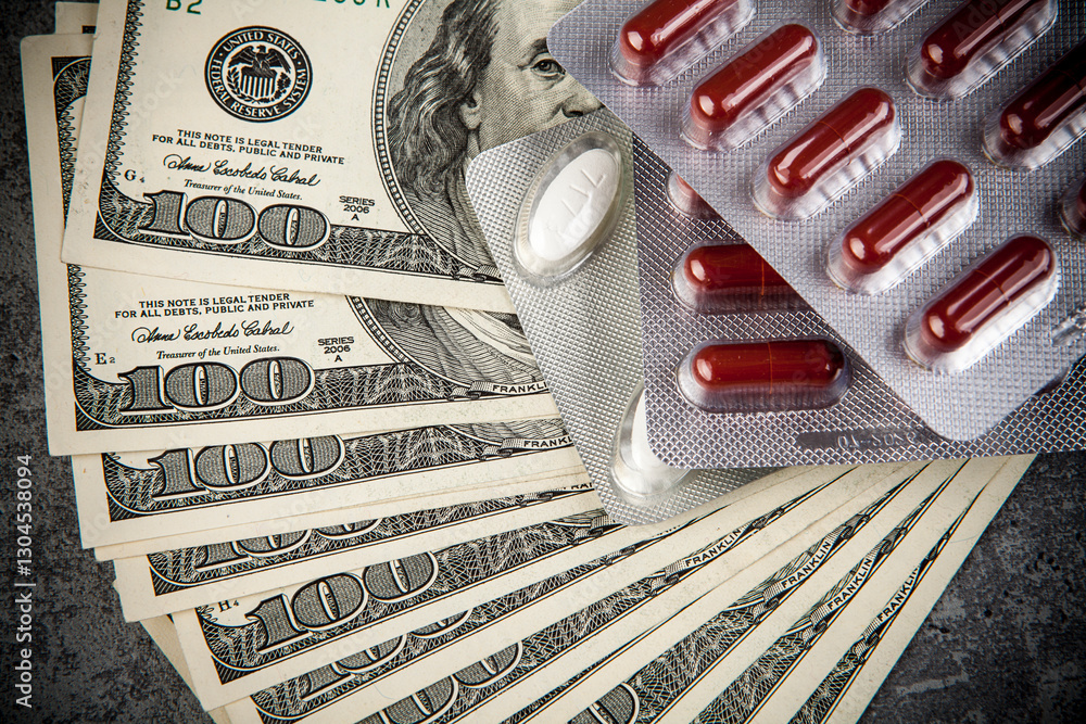 Pills and capsules on the background of the dollar. The concept of expensive medicine.