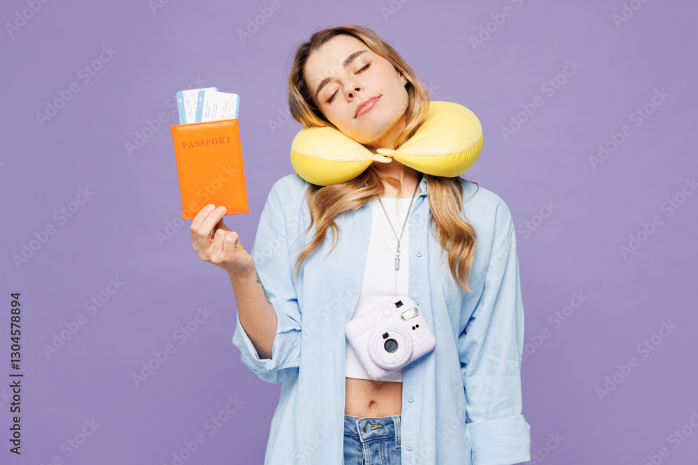 Traveler woman wear blue clothes hold passport ticket neck pillow close eyes isolated on plain purple background. Tourist travel abroad in free spare time rest getaway Air flight trip journey concept Traveler woman wear blue clothes hold passport ticket neck pillow close eyes isolated on plain purple background. Tourist travel abroad in free spare time rest getaway Air flight trip journey concept