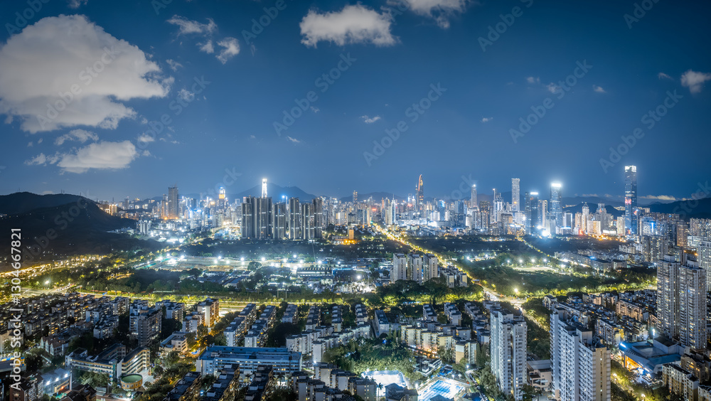 Aerial night view of modern Shenzhen cityscape with illuminated skyscrapers Aerial night view of modern Shenzhen cityscape with illuminated skyscrapers