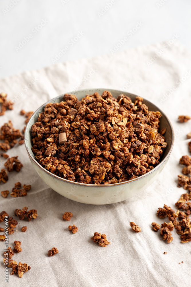 Homemade Healthy Chocolate Granola in a Bowl, side view. Homemade Healthy Chocolate Granola in a Bowl, side view.