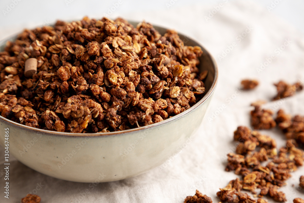 Homemade Healthy Chocolate Granola in a Bowl, side view. Close-up. Homemade Healthy Chocolate Granola in a Bowl, side view. Close-up.
