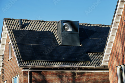 Modern town house with integrated heat pump and solar panels on the roof in Assen, Netherlands, showcasing architecture and sustainability 