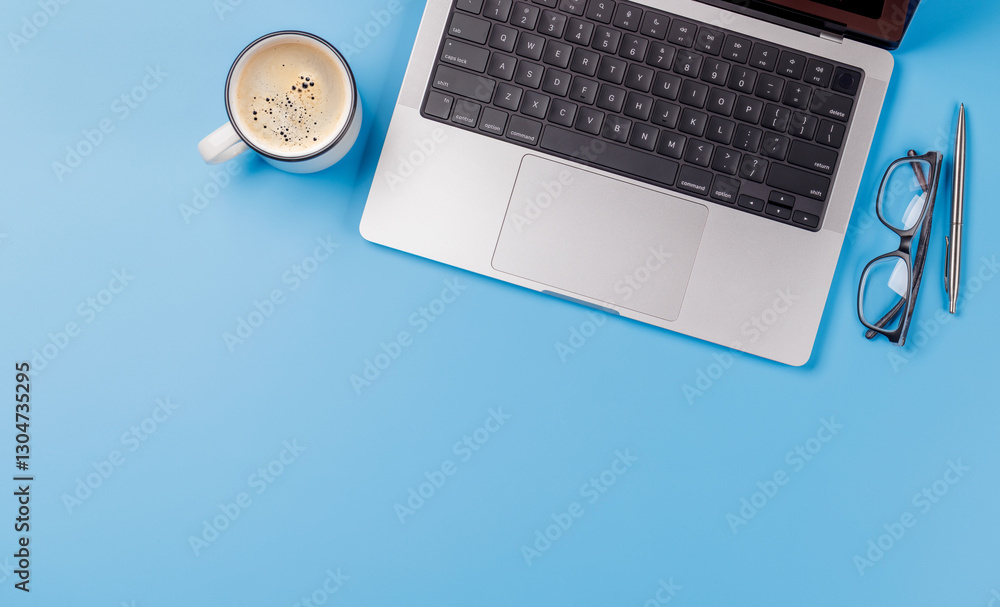 A clean and minimal desk setup featuring a laptop and a coffee cup A clean and minimal desk setup featuring a laptop and a coffee cup