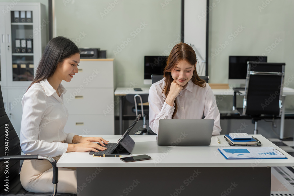 Business woman working and studying together with tablet document graph paper in office, discuss finance and marketing solution reporting file in working place. Business woman working and studying together with tablet document graph paper in office, discuss finance and marketing solution reporting file in working place.