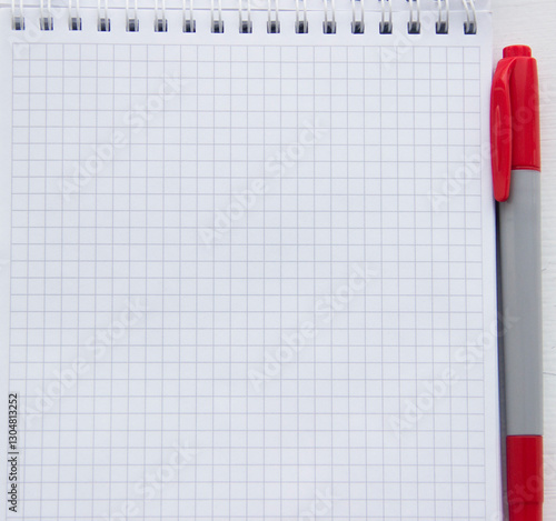 Konstfotografi Checkered notebook with red marker