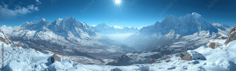 Obraz premium Snowy mountains with the sun shining brightly over the peaks, casting warm light on the snowy landscape, clear blue skies creating a serene and majestic atmosphere, concept of winter, adventure, natur